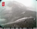 The camera captures the moment when the wall of tephra that had been holding back the Crater Lake failed, triggering the spectacular lahar.